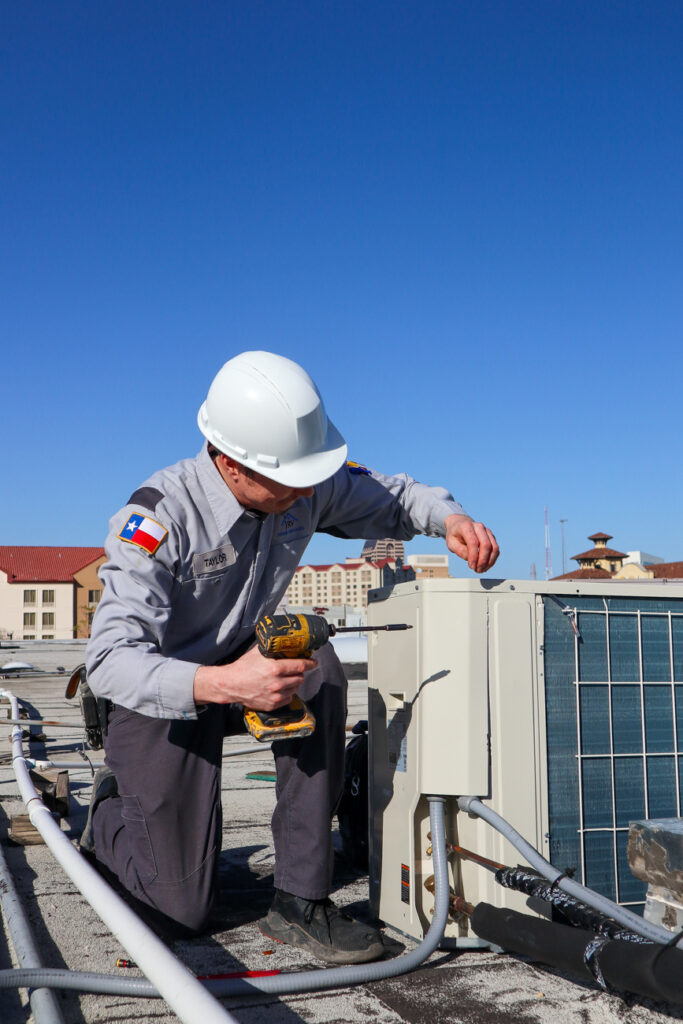 Technician working on HVAC